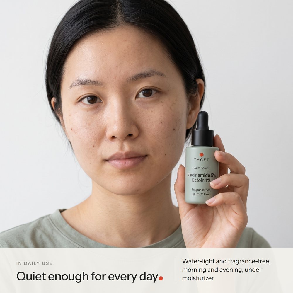 Tacet Calm Serum held beside a woman's cheek, label facing the camera